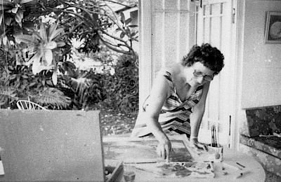 My mother, Noela Breusch, painting in the sunroom.